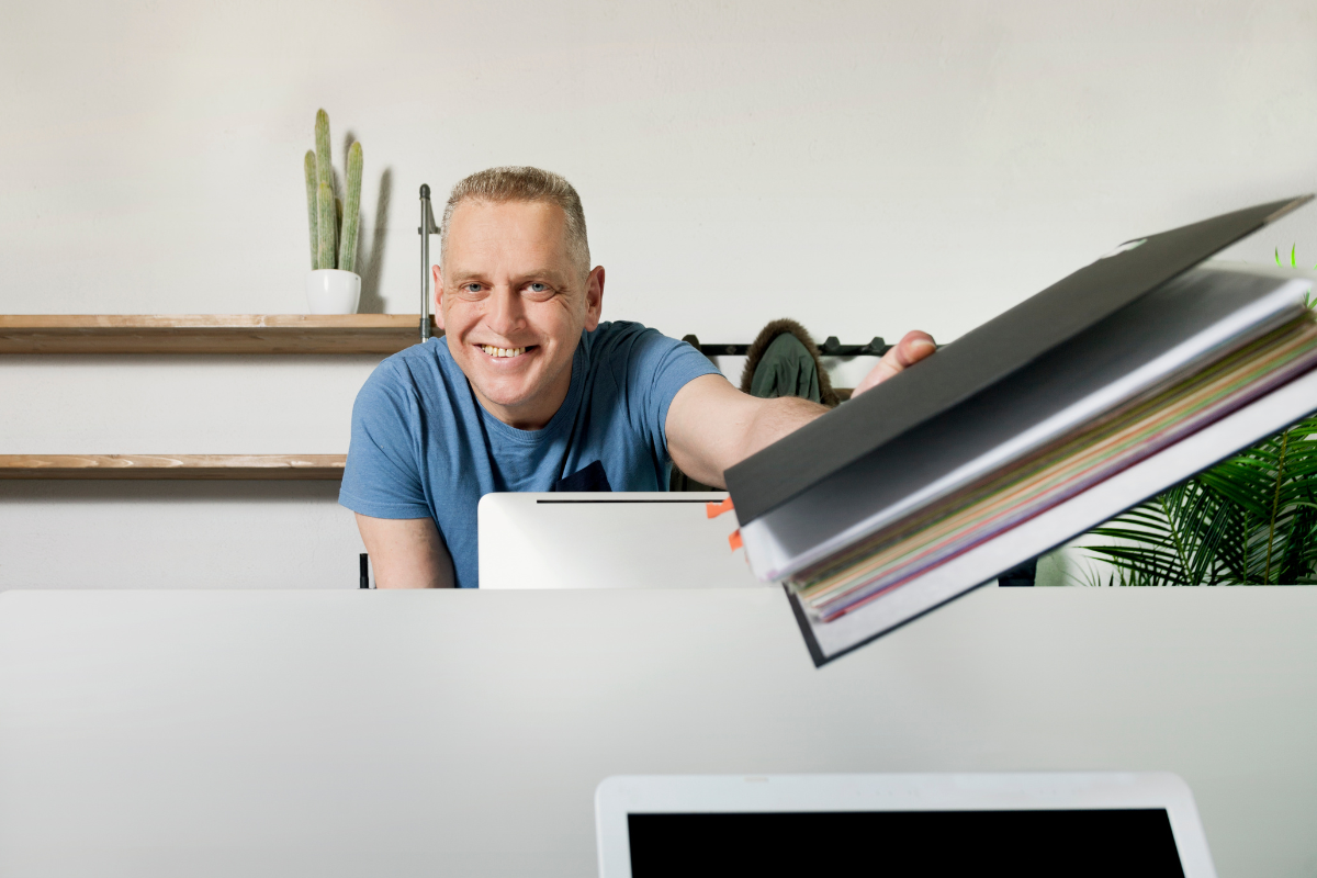 Courier delivering marketing materials to an office